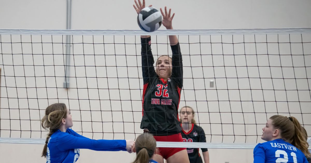 How to Play Volleyball for Beginners: Friendly Guide in 2024 1 How to Play Volleyball for Beginners: A female volleyball player blocking a ball at the net